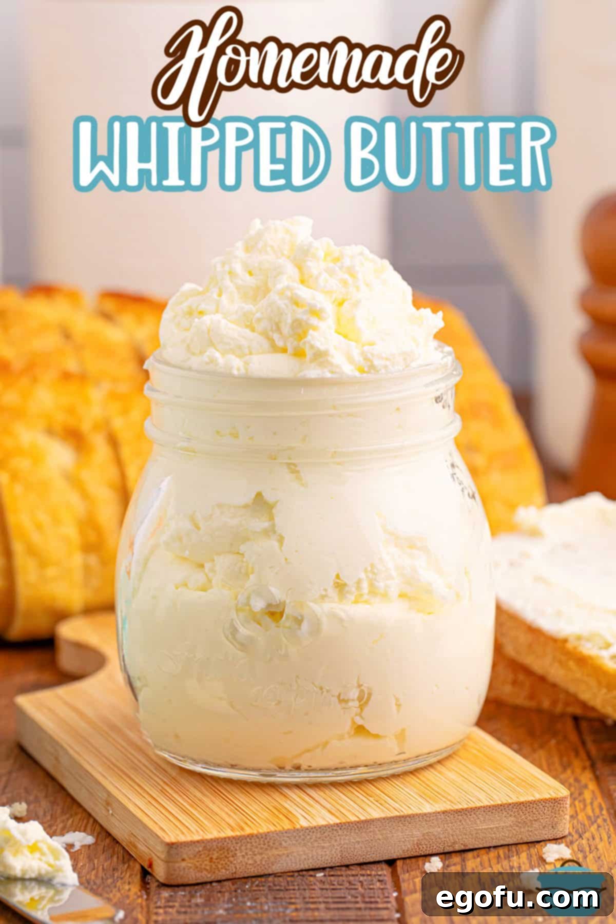 An inviting jar overflowing with golden homemade whipped butter, showcasing its fluffy texture.