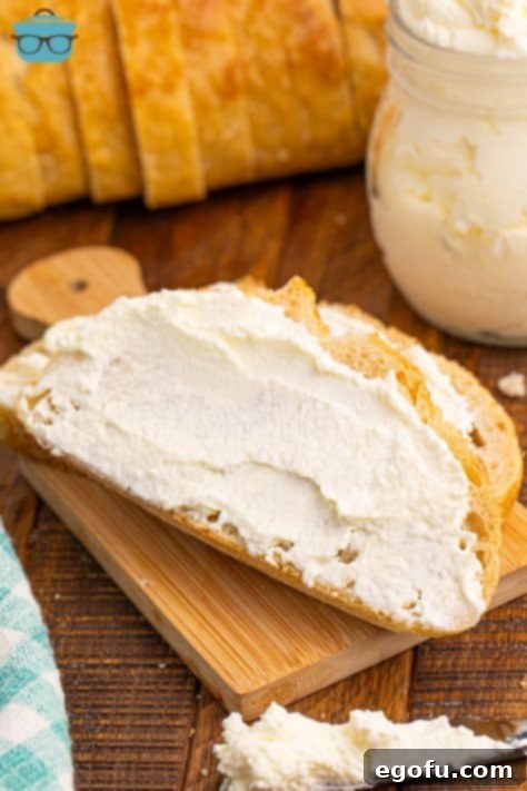 Some homemade whipped butter spread out on a slice of bread, ready to be enjoyed.