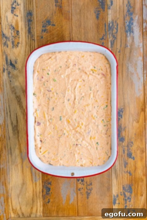 Stars and Stripes Celebration Dip 14 A baking dish with taco dip spread on the bottom.