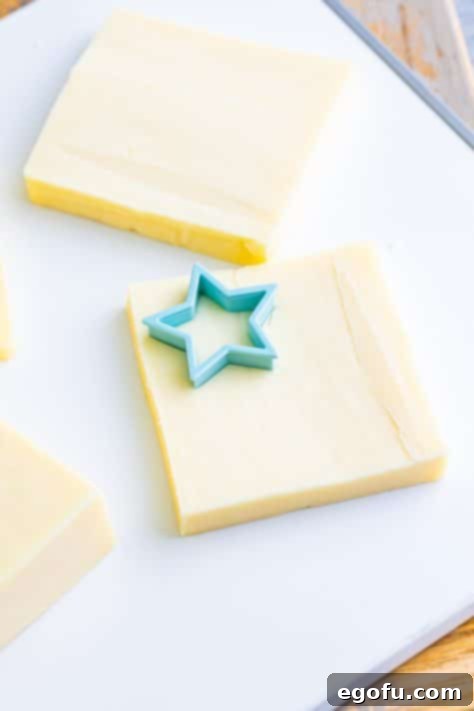 Stars and Stripes Celebration Dip 16 A star cookie cutter on a slice of Monterey Jack cheese.
