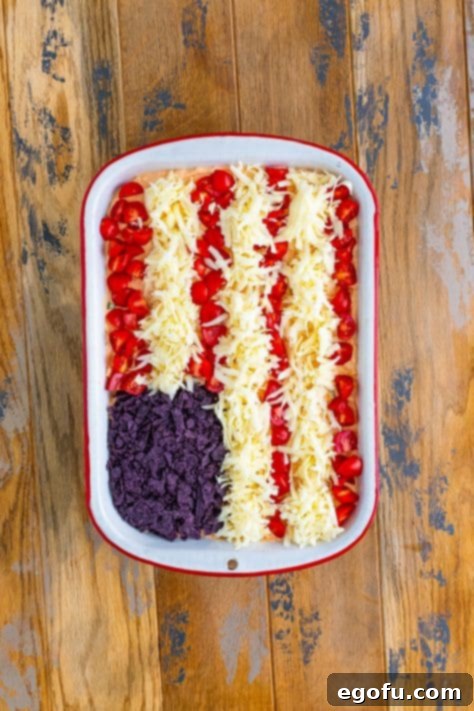 Stars and Stripes Celebration Dip 19 A flag taco dip in a baking dish.