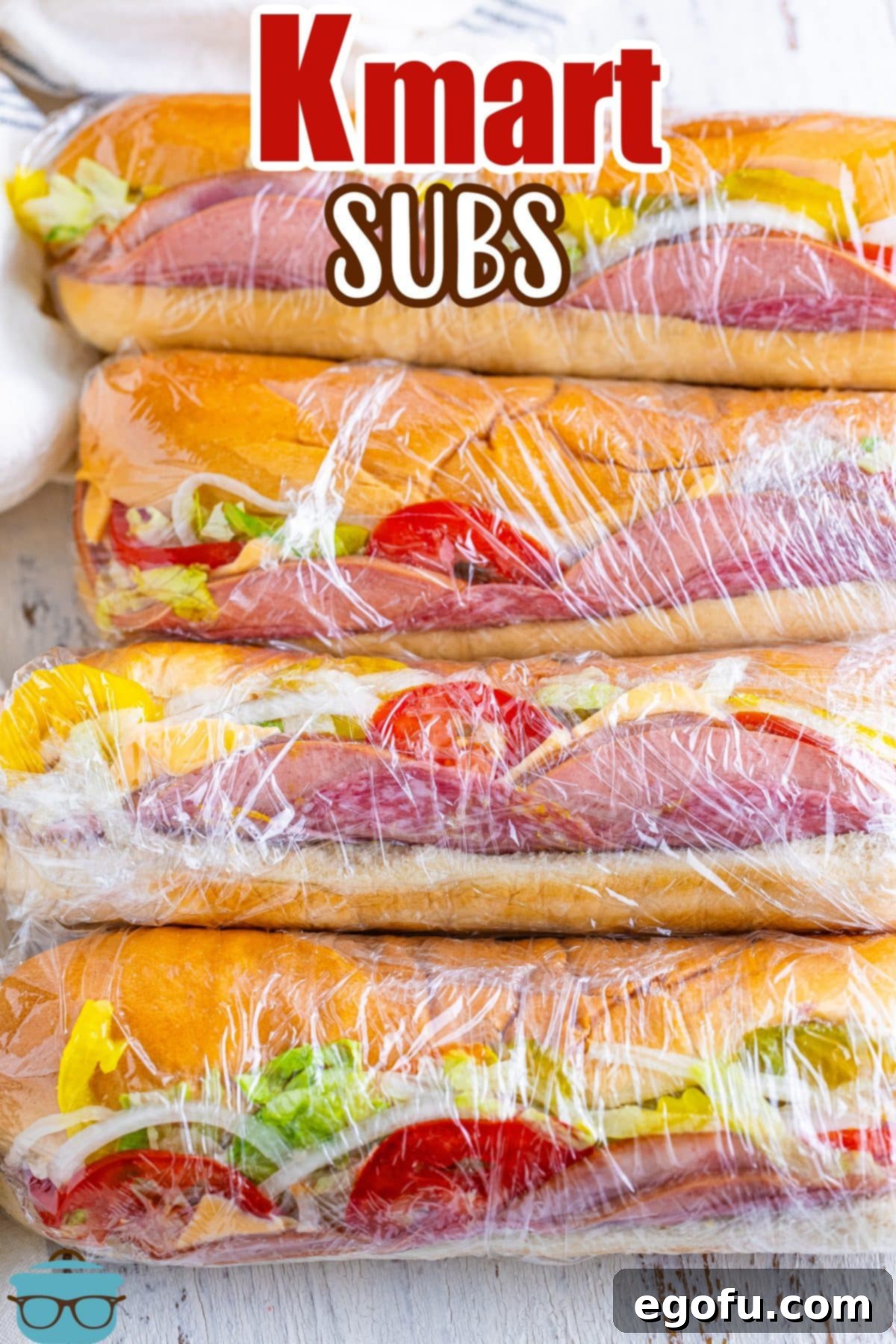 A perfectly arranged line of homemade copycat Kmart Subs, ready to be enjoyed as a classic, nostalgic lunch.