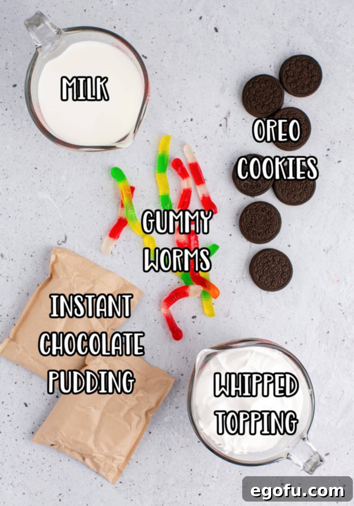 Gummy worms, Oreo cookies, Milk, whipped topping, and instant chocolate pudding mix.