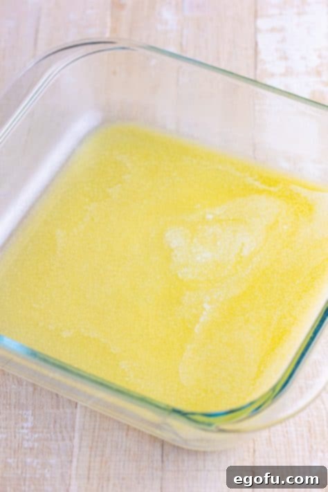 Golden Butter Soaked Cinnamon Sugar Biscuits 10 melted butter in a baking dish.