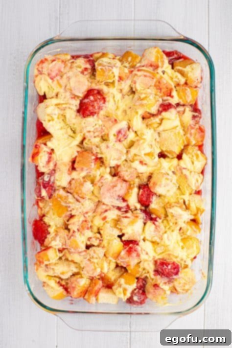 Stirred up layers of a no bake patriotic cake dessert.