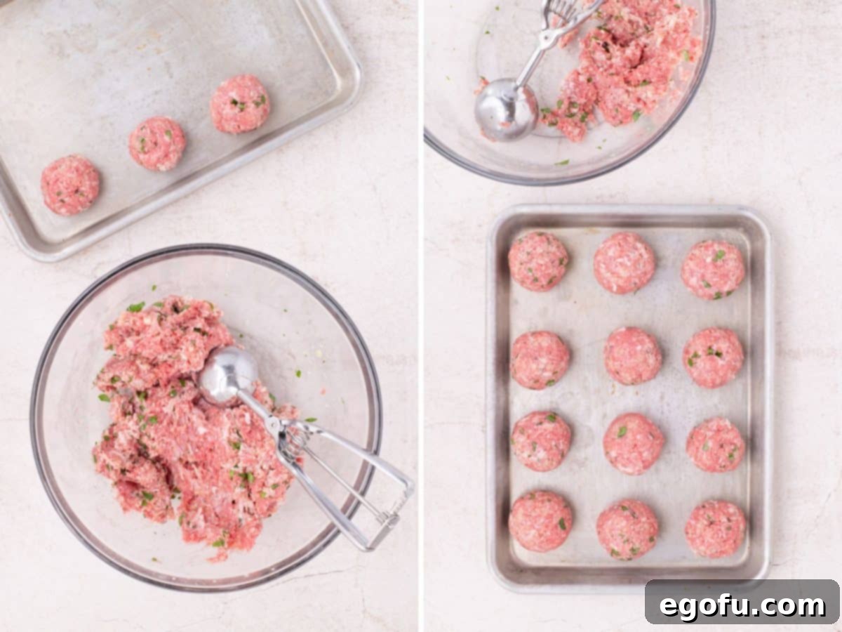 Effortlessly Delicious Air Fryer Meatballs 8 A cookie scoop in a bowl of meatball meat. A baking sheet with uncooked meatballs.