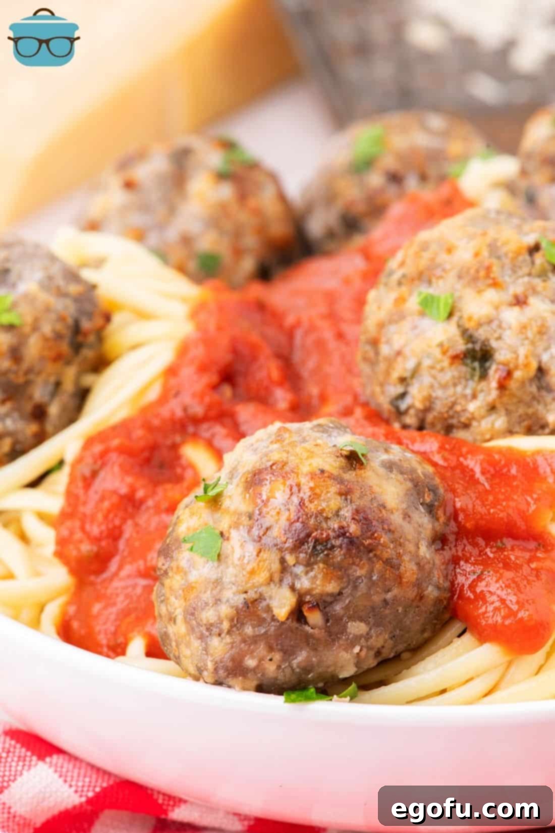 Effortlessly Delicious Air Fryer Meatballs 10 A few Air Fryer Meatballs on a bowl of pasta and sauce.