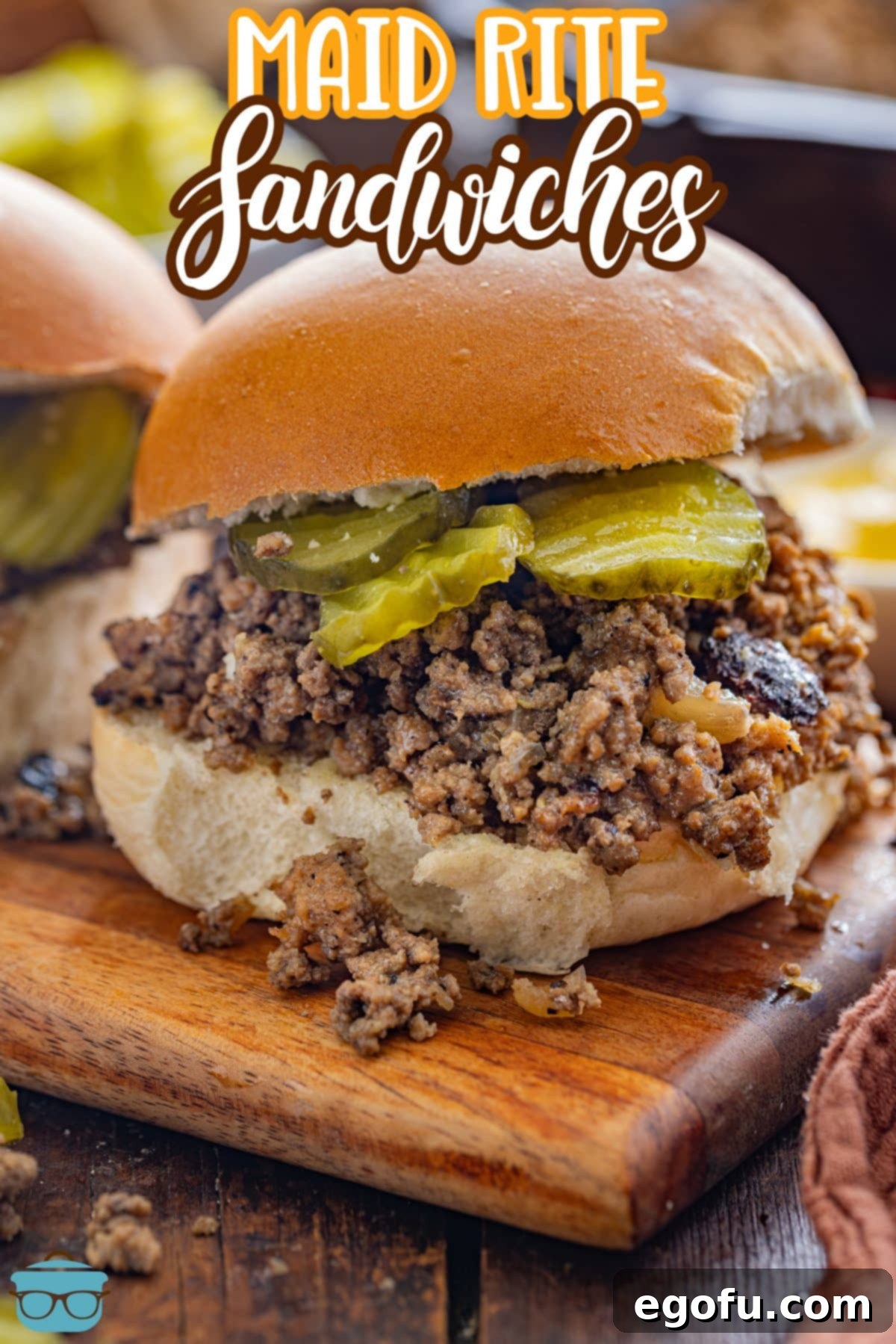 Crumble Burger 4 a closeup photo of a maid rite sandwich on a wood board.