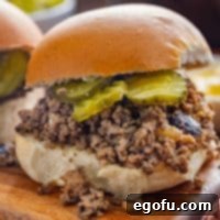 Crumble Burger 9 a closeup photo of a Maid Rite Sandwich on a wooden board.