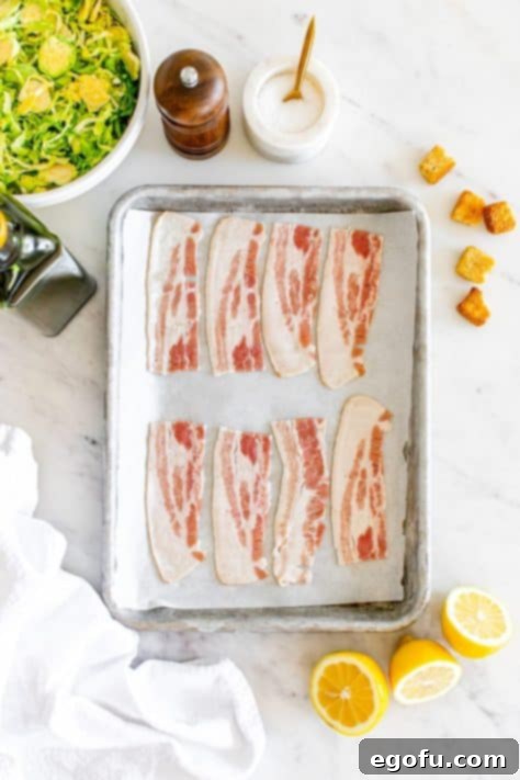 Bacon on a lined baking sheet.