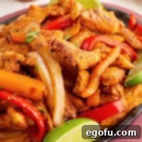 Closely looking at a platter of Chicken Fajitas.