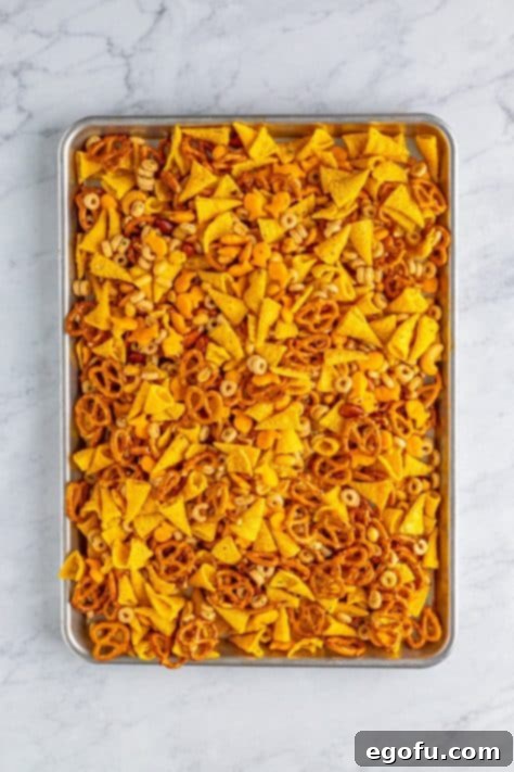 A sheet pan with Ranch Bugle Snack Mix spread out.