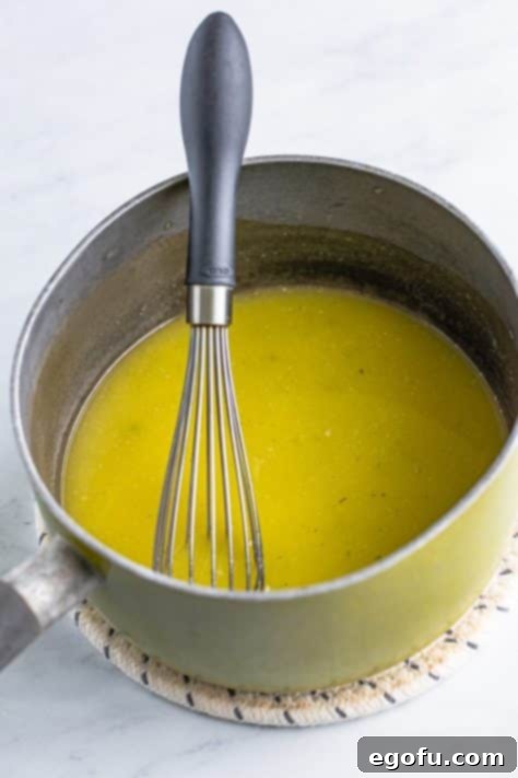 Melted butter and ranch seasoning in a pan.