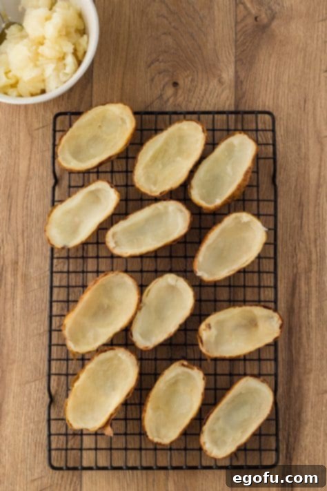 Hulled out cooked potatoes.