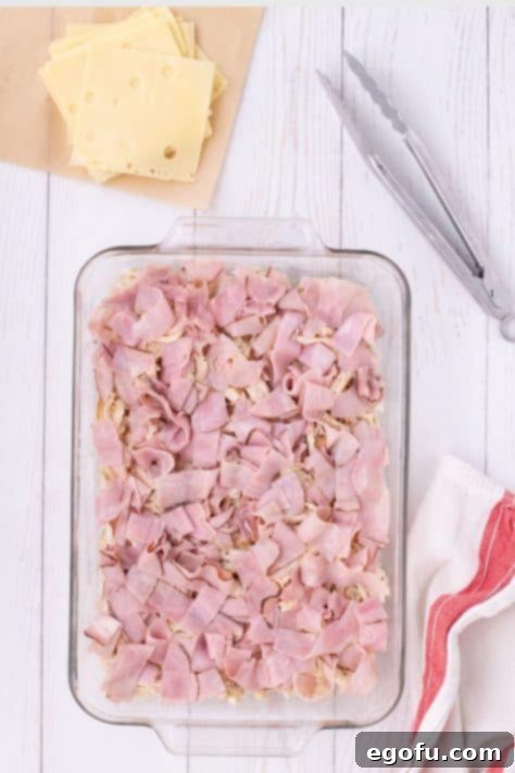 Golden Baked Chicken Ham and Swiss Casserole 13 Ham and chicken in a baking dish.