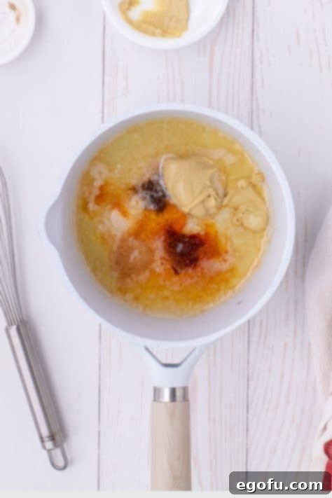 Golden Baked Chicken Ham and Swiss Casserole 15 Melted butter, Dijon mustard, lemon juice, garlic powder, salt, nutmeg, and cayenne pepper in a saucepan.