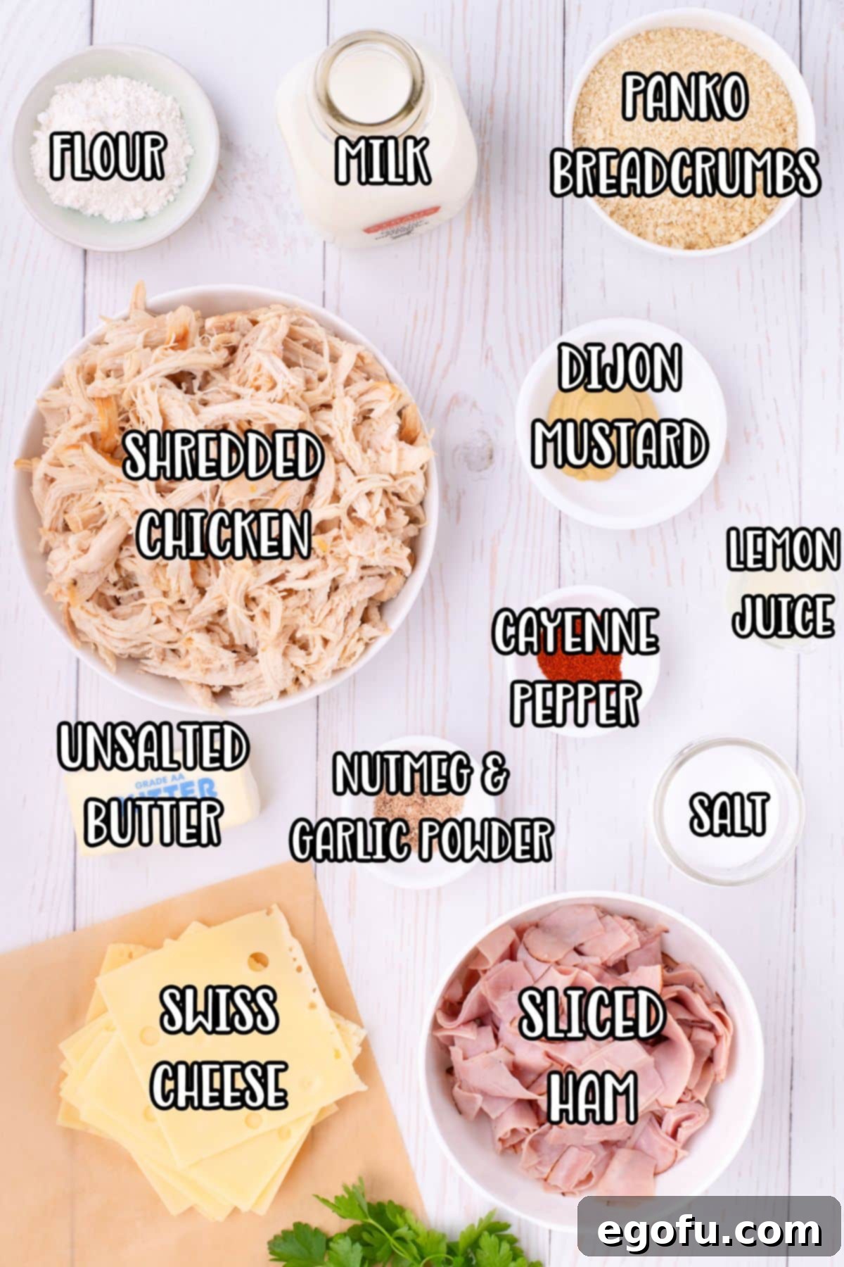 Golden Baked Chicken Ham and Swiss Casserole 4 A visual collage of ingredients: Shredded chicken, sliced Black Forest ham, Swiss cheese, butter, flour, Dijon mustard, lemon juice, garlic powder, salt, nutmeg, cayenne pepper, milk, and Panko breadcrumbs, along with a sprinkle of parsley.