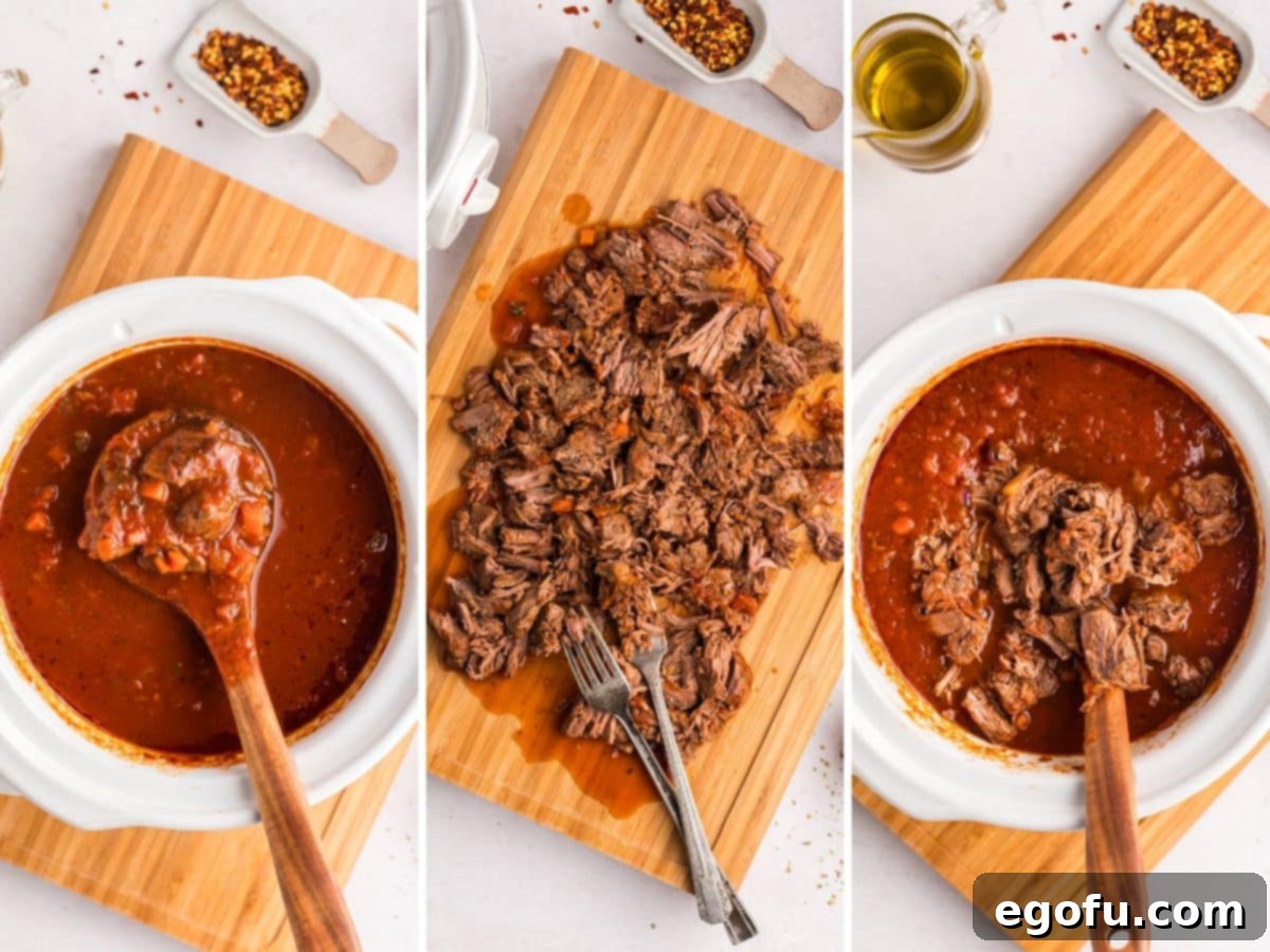 Shredded beef chuck steak on a cutting board.