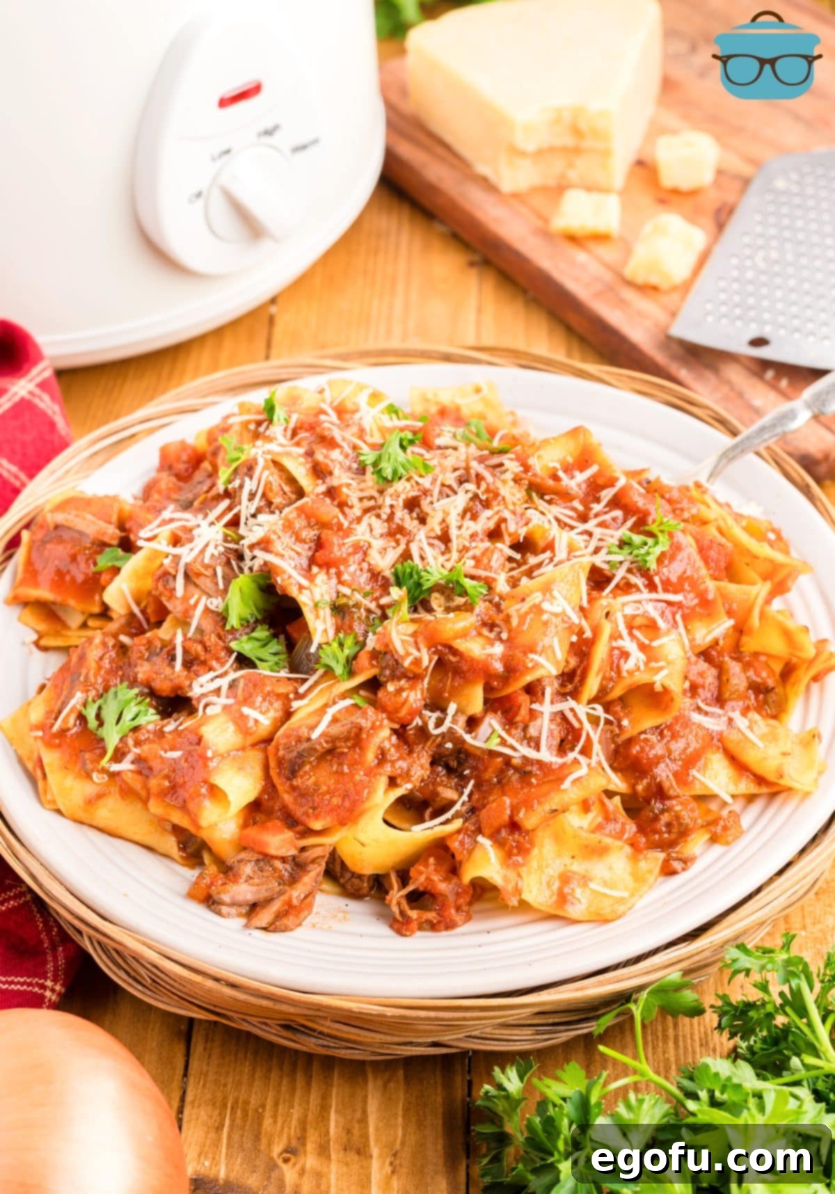 A plate of Crock Pot Beef Ragu sauce with pasta. 