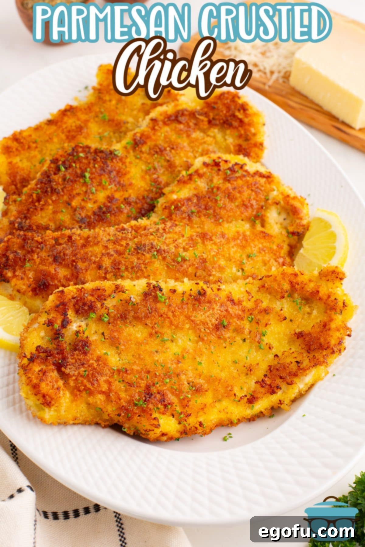 Crispy Parmesan Chicken Delight 3 A plate of perfectly cooked Parmesan Crusted Chicken, garnished and ready to be served.