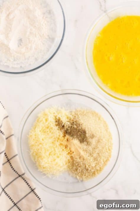 Crispy Parmesan Chicken Delight 10 A bowl of parmesan, panko, garlic powder, and Italian seasoning mixed together for breading.