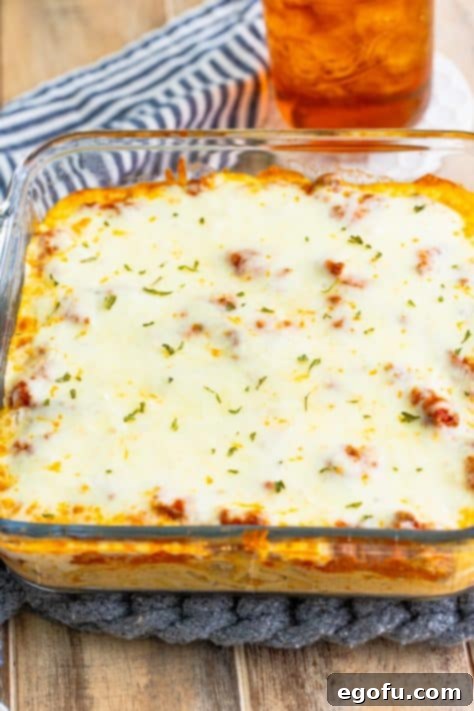 Baked Spaghetti for Two in the baking dish, just out of the oven, with melted and bubbly cheese.