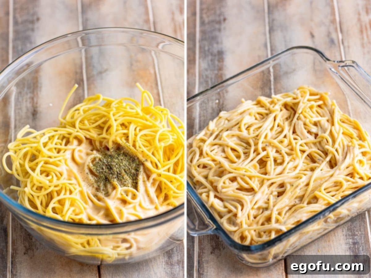 Alfredo sauce and spaghetti in a bowl, and the mixture layered at the bottom of a baking dish, illustrating the base layer.