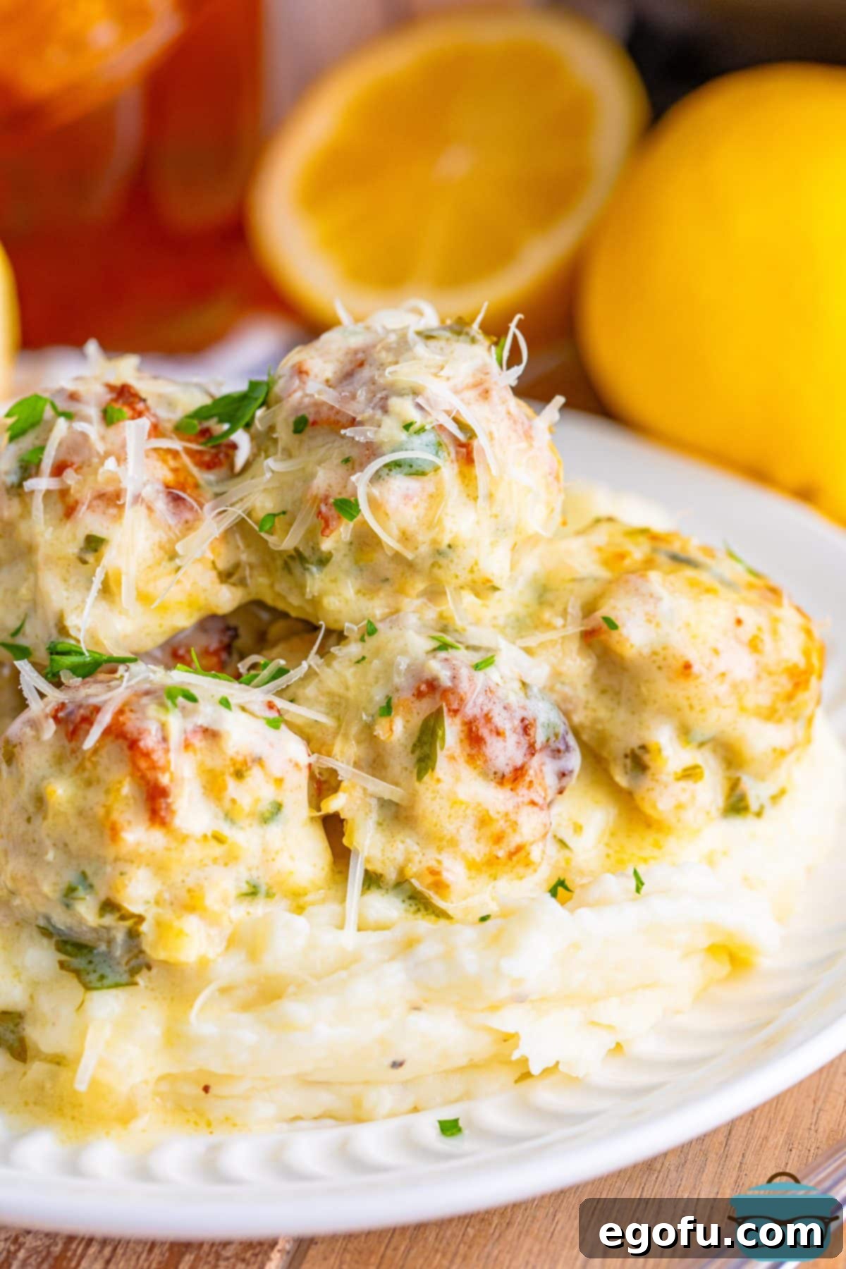 Zesty Piccata Chicken Bites 2 Closely looking at Chicken Piccata Meatballs on a plate.