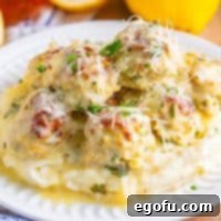 Zesty Piccata Chicken Bites 13 A plate of Chicken Piccata Meatballs with sauce.