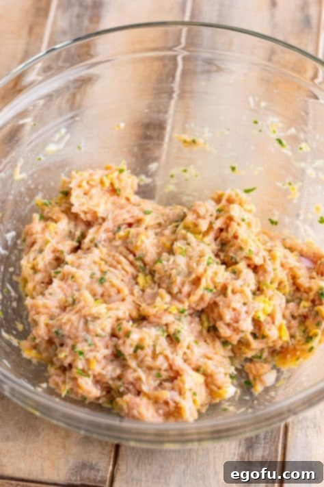 Zesty Piccata Chicken Bites 15 Ground chicken added to the torn white bread, milk, parmesan cheese, egg, shallot, lemon zest, salt, and parsley mixture.