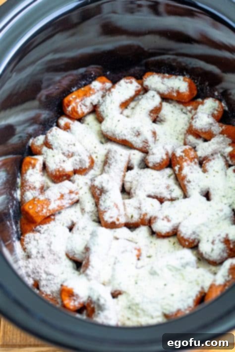 Irresistible Slow Cooker Mississippi Sausages 11 Lil smokies, ranch, au jus gravy mix and pepperoncini juice in a slow cooker.