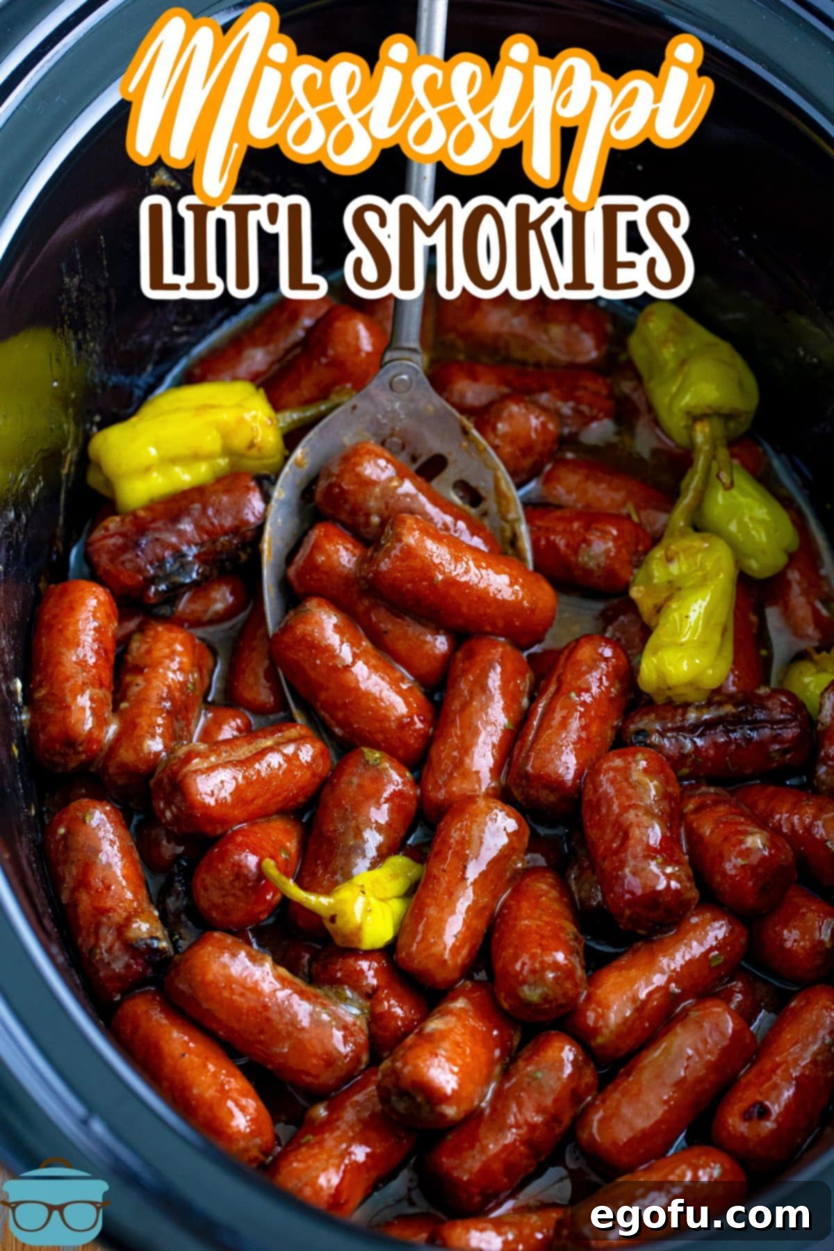 Irresistible Slow Cooker Mississippi Sausages 3 A spoon stirring some Crock Pot Mississippi Lit'l Smokies, showing the rich, glossy sauce coating the sausages.