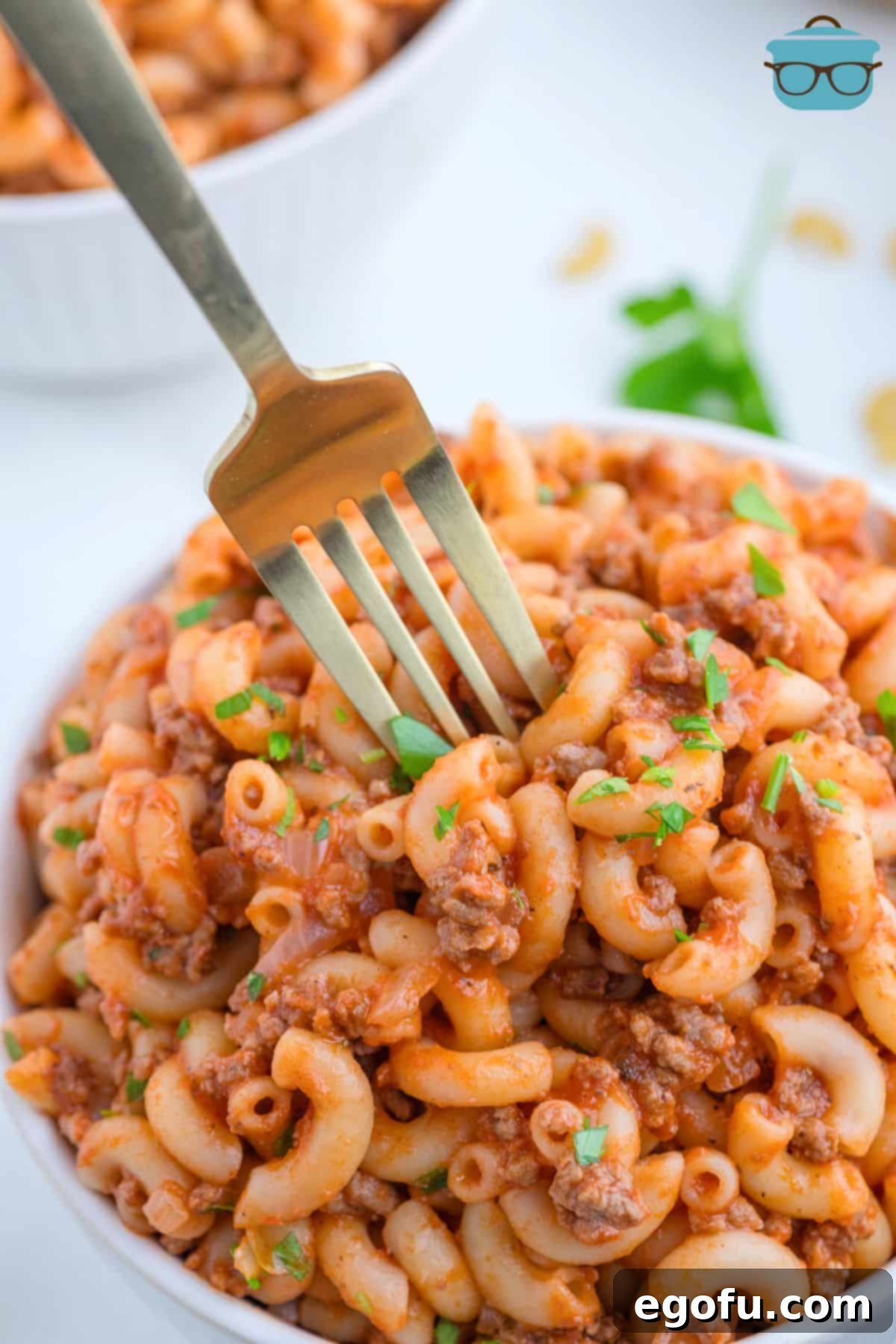 A fork in a bowl of Beefaroni.