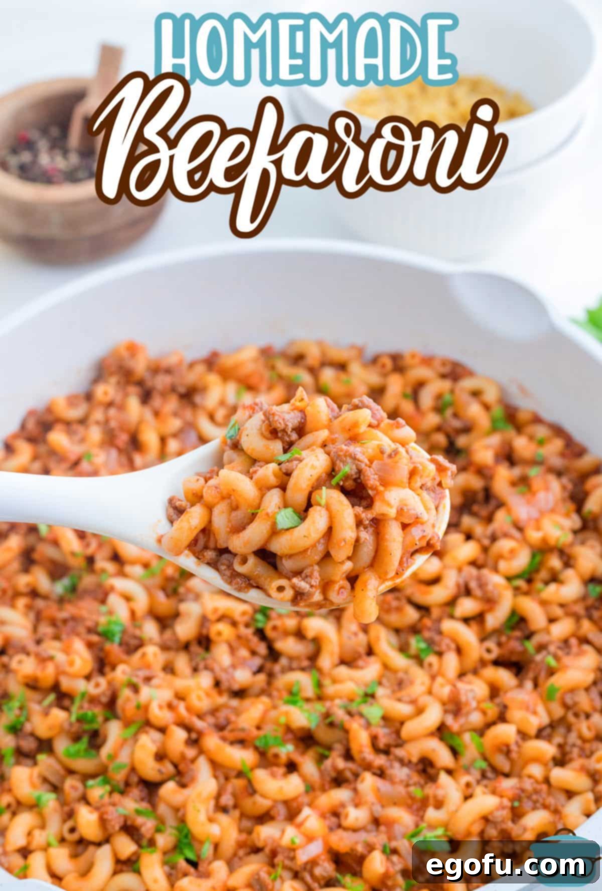 A wooden spoon holding a scoop of Beefaroni.