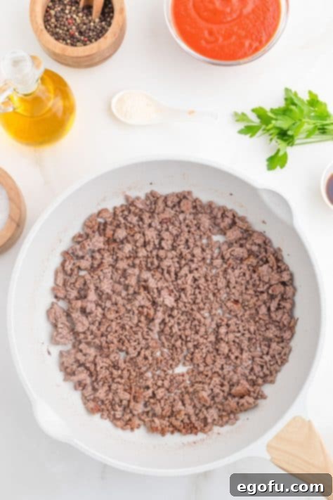 Ground beef in a skillet.