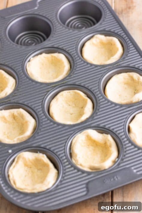 Biscuits pressed in a muffin tin.