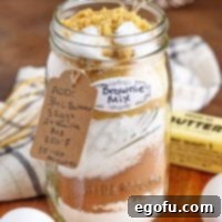 A jar of Homemade Brownie Mix with a tag and label.
