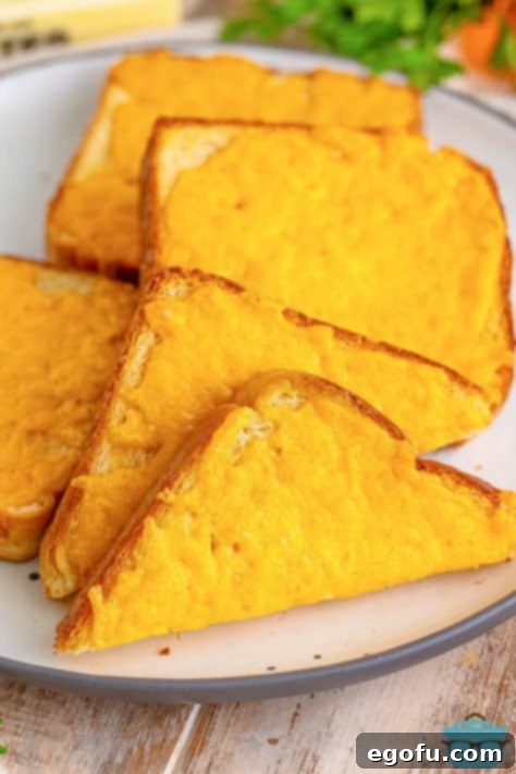 A few slices of Cheese Toast and one cut in half.