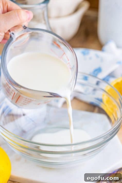 Milk being added to a bowl.