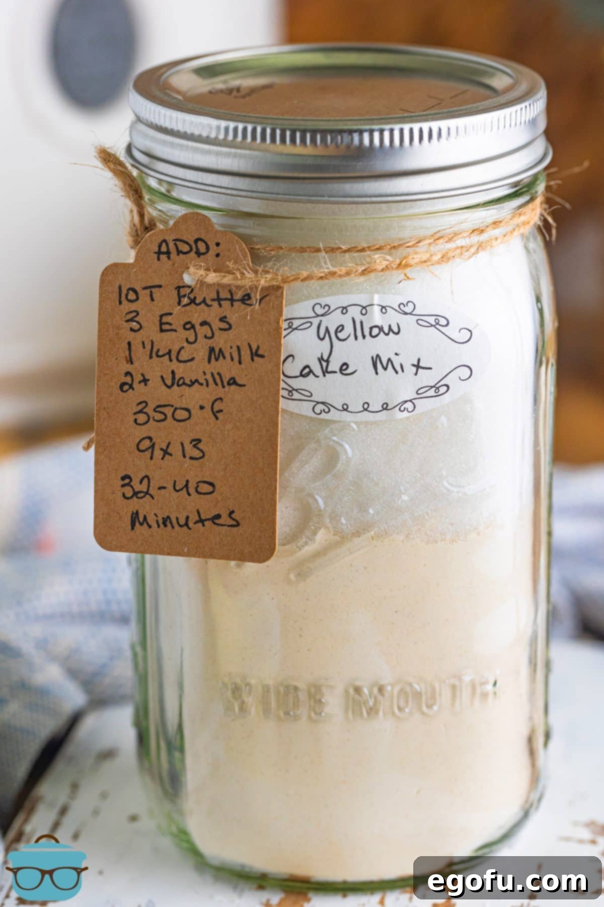 Close up looking at a glass Mason Jar of Homemade Yellow Cake Mix.