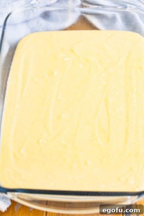 Yellow cake batter in a baking dish.