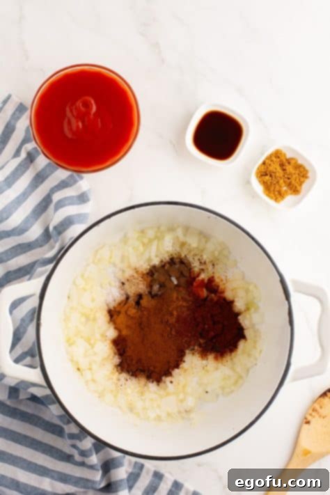 Cincinnati's Signature Chili 12 Diced onions and spices in a pot.