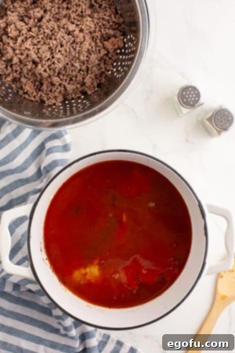 Cincinnati's Signature Chili 13 A pot with onions, spices, omato sauce, broth, vinegar, sugar, and Worcestershire sauce.