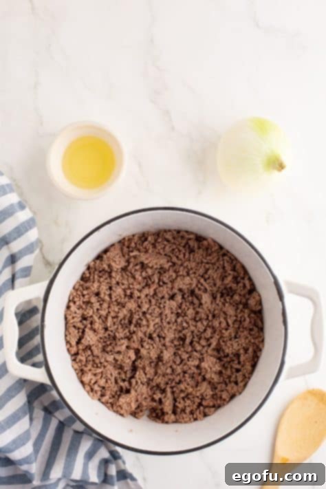 Cincinnati's Signature Chili 10 Cooked ground beef in a pot.