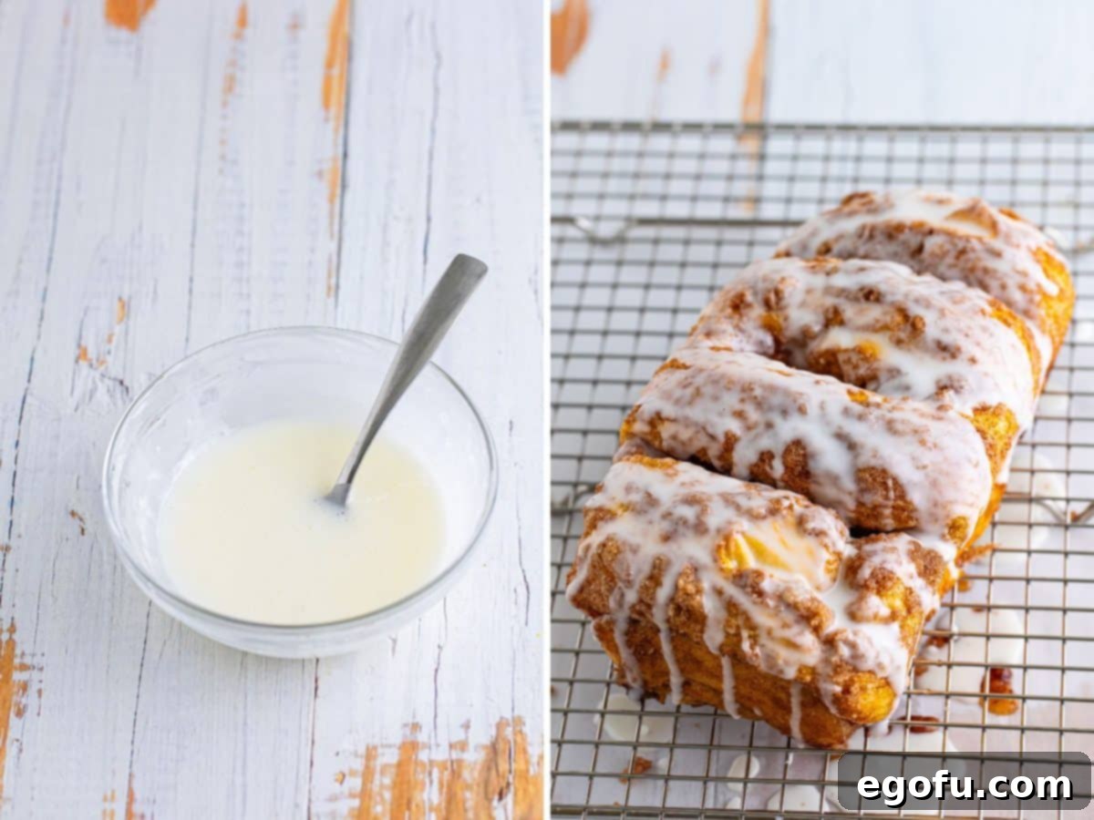 A small mixing bowl of sweet glaze and a freshly glazed loaf of Cinnamon Bread on a wire rack, shimmering with sweetness.