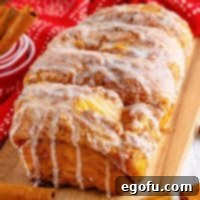 A loaf of Dollywood Cinnamon Bread cut into big sections, showing its gooey center.