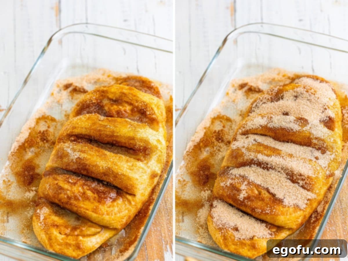 An uncooked loaf of bread, glistening with butter and cinnamon sugar, ready for its final preparation.