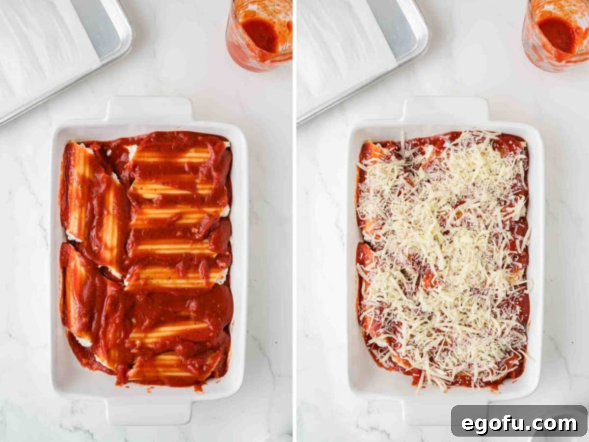 Effortless Manicotti 7 An unbaked dish of Manicotti, with filled shells covered in marinara sauce and a generous layer of shredded cheese on top, ready for the oven.