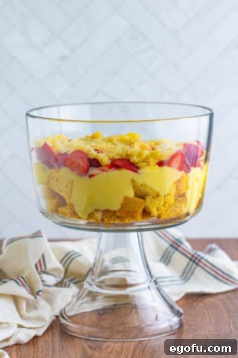 Party Perfect Bowl Cake 16 Drained and crushed pineapple, strawberries, pudding and cake pieces in a bowl.