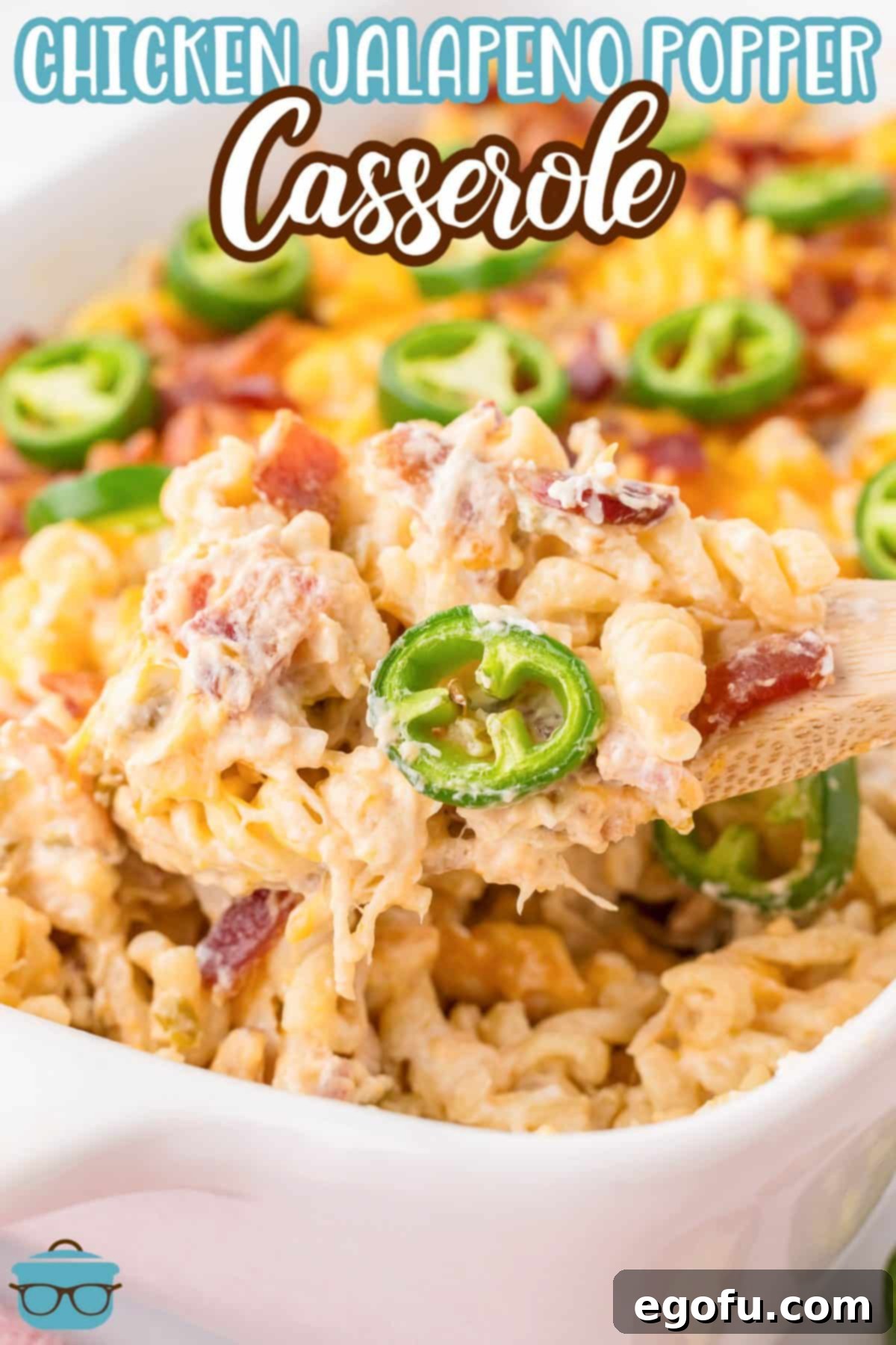 A casserole featuring jalapeno poppers and chicken, bubbling from the oven with a crispy, golden top.